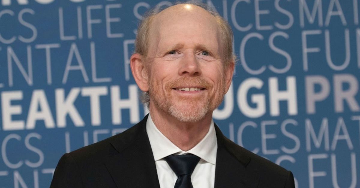 Ron Howard smiling at a public event, highlighting his successful career and $200 million net worth in Hollywood.